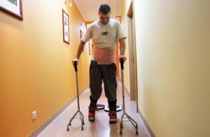 Man in hallway with walkers
