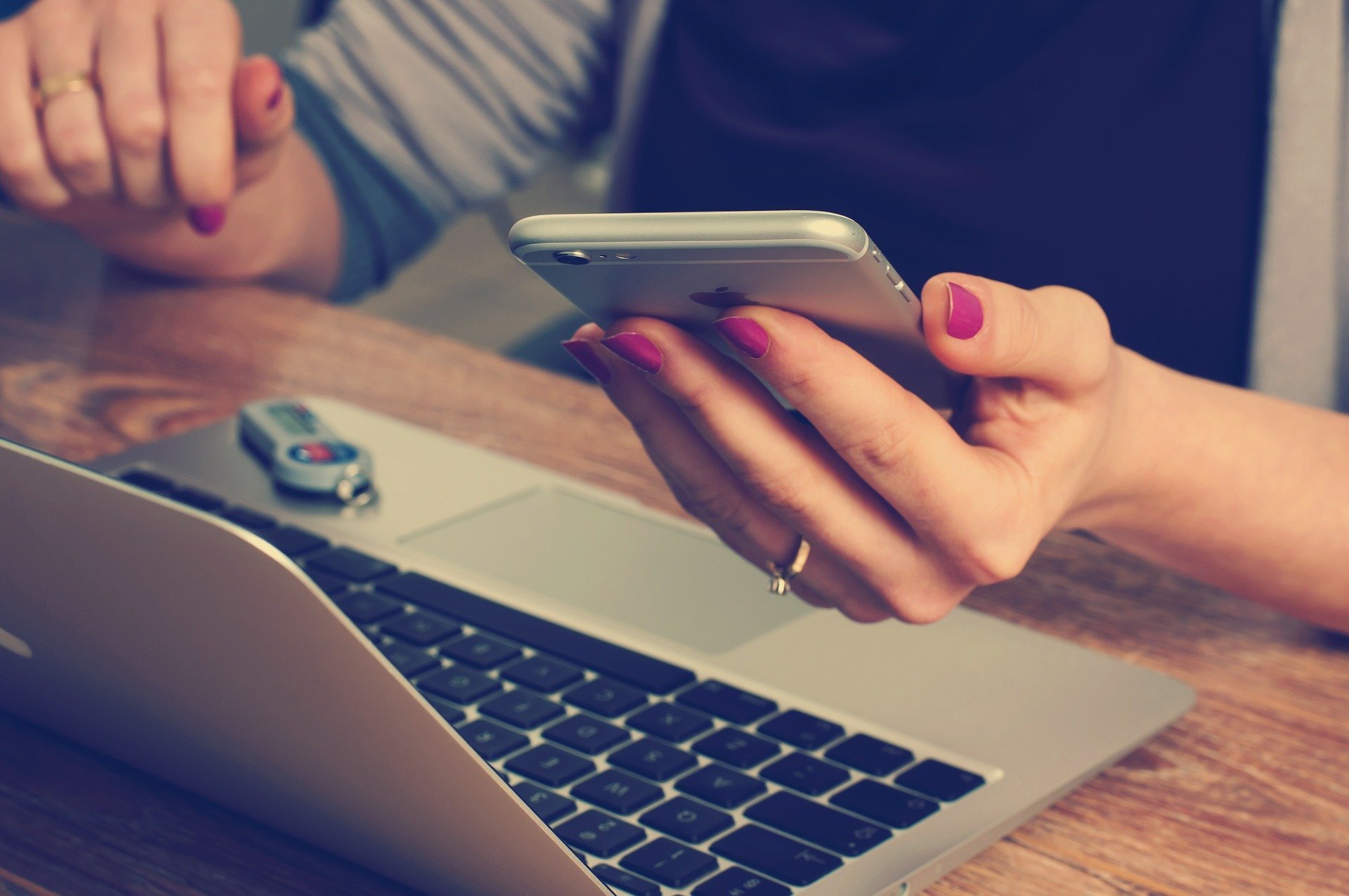 Girl on Phone at computer