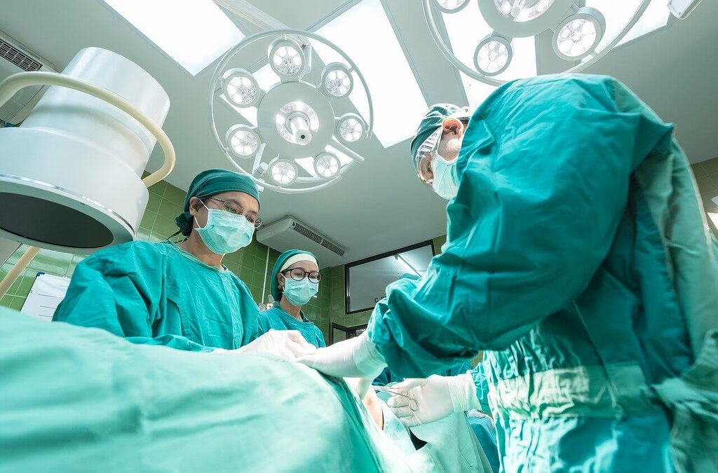 Doctors Performing Surgery with Patient Under Anesthesia