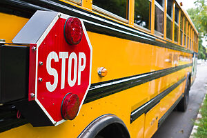 Yellow School Bus with Stop Sign
