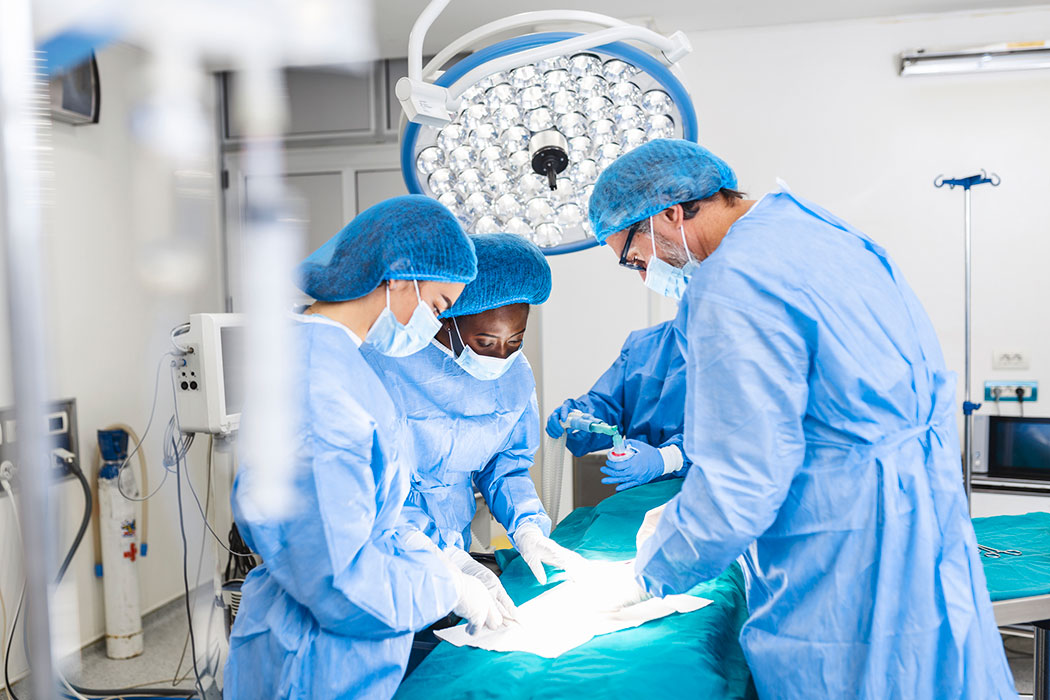 Surgical team operating on a patient in an operating room, illustrating serious hospital errors handled by a Southfield medical malpractice lawyer.