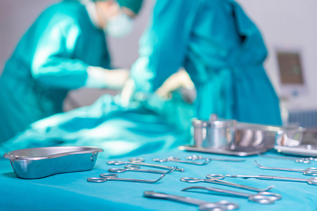 Surgical instruments including scalpels and forceps laid out on a table, representing surgical errors and medical malpractice cases in Southfield.