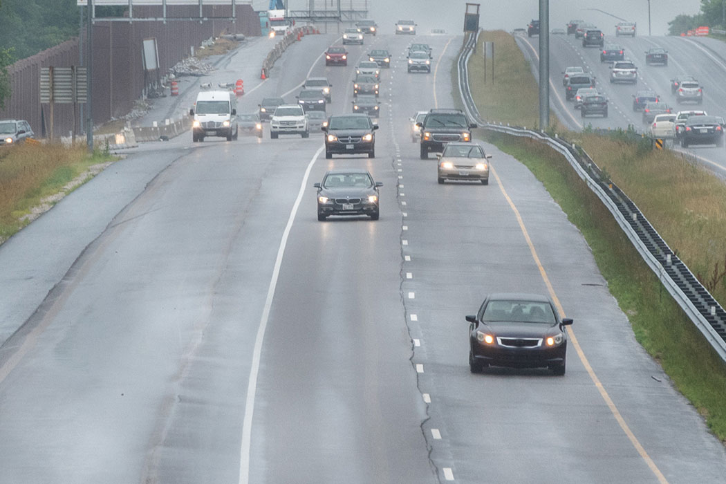 Heavy traffic on a congested highway in rainy weather, representing high-risk locations for car accidents around Detroit.