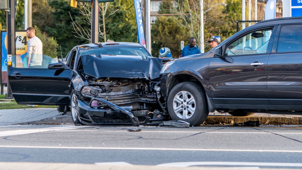 Two vehicles involved in a serious intersection collision with significant front-end damage. 