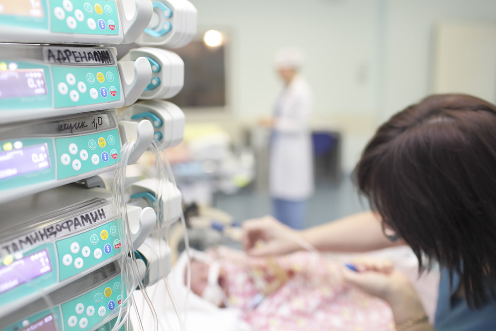 nurse taking care of baby in nursey